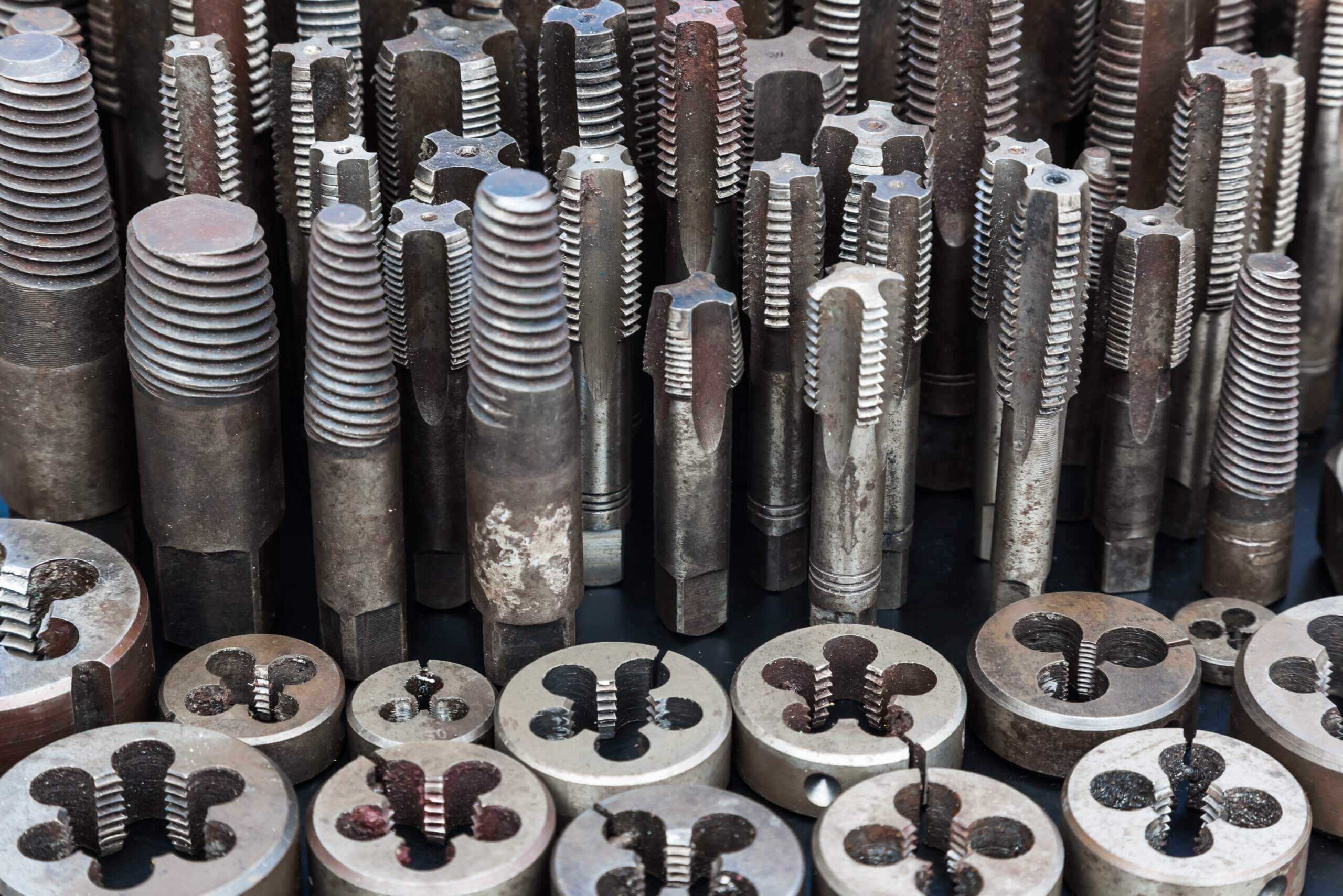 Metal threading taps and dies
